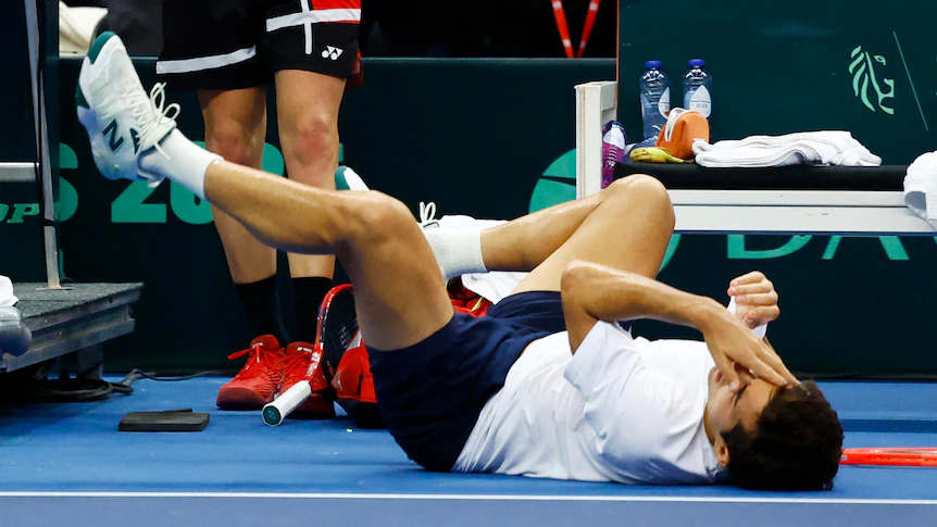 Belgium's Zizou Bergs knocks over Chilean Cristian Garin during Davis Cup tie