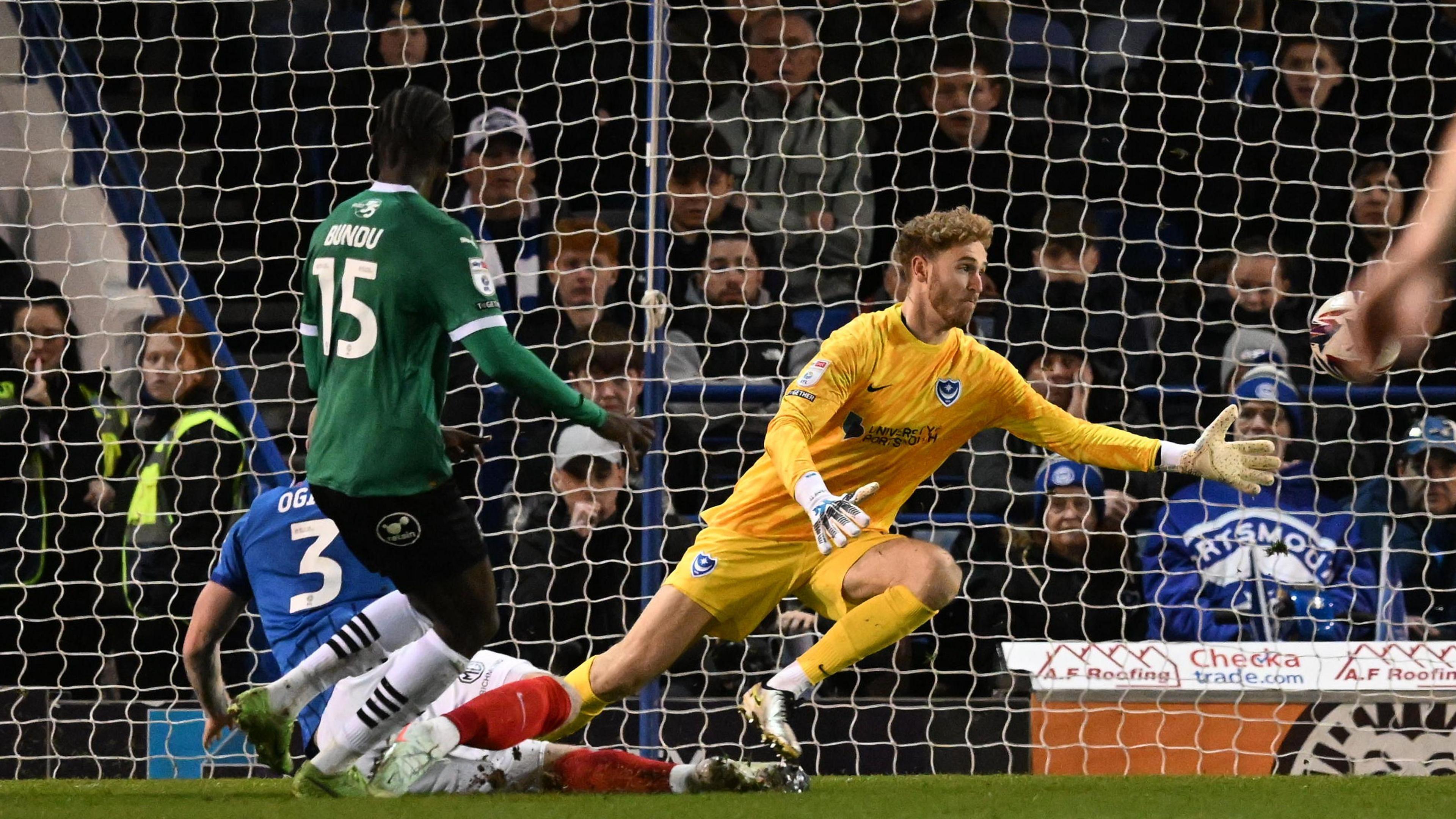 Ten-man Plymouth hold on at Portsmouth for first away win