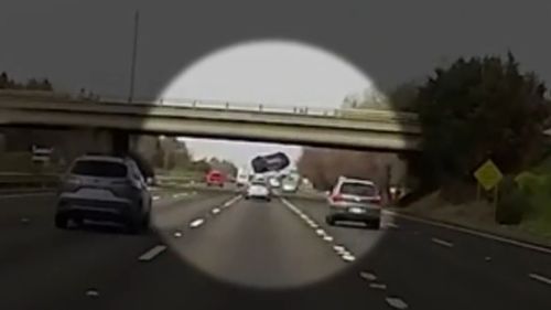 Dashcam video shows car flying off US overpass