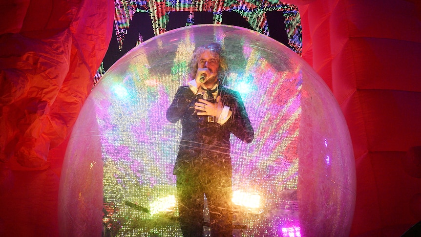 The Flaming Lips are known for incredible live shows, but frontman Wayne Coyne says it's all an act